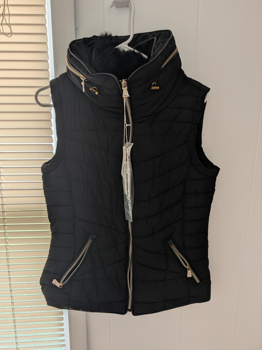 Women's Black Quilted Puffer Vest with High Collar and Gold Trim